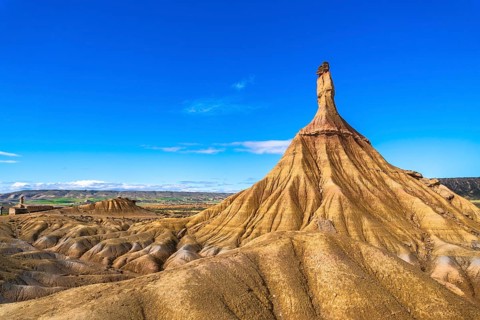 Eroded rock formations create a dramatic landscape in the bardenas reales desert, navarre, spain,