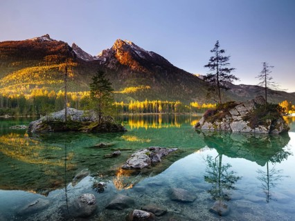 Hintersee in the morning in the first sunlight, behind the peaks of the Hochkalter, Berchtesgaden