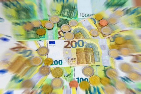 Close-up of euro banknotes and euro coins