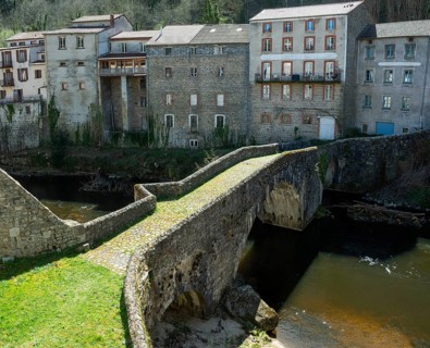 Olliergues village. Old bridge on river Dore. Natural regional park of Livradois Forez. Puy de Dome