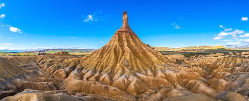 Eroded rock formations creating a breathtaking panorama in the bardenas reales desert under a