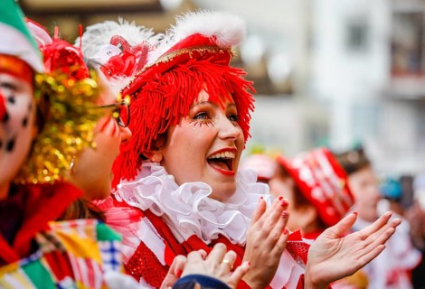 Colourfully costumed carnivalists celebrate carnival in Cologne, on Weiberfastnacht the street