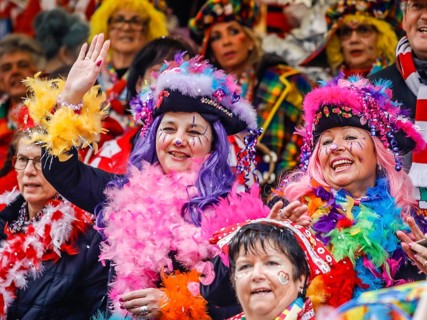 Colourfully costumed carnivalists celebrate carnival in Cologne, on Weiberfastnacht the street