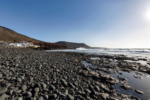 Rocky west coast, black lava coast, coastline, sunbeams, El Golfo, Yaiza, Lanzarote, Spain, Europe