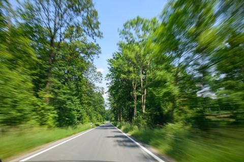 Symbolic image for speeding speeding dangerous driving at excessive speed by speeders on narrow