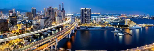 Kobe skyline from above with harbour and elevated road panorama at night in Kobe, Japan, Asia