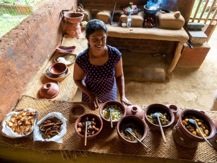 Sinhala woman prepares lunch in clay pots, Sri Lanka, Asia