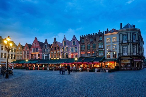 Bruges, Belgium, May 29, 2018: Bruges Grote markt square famous tourist place with many cafe and