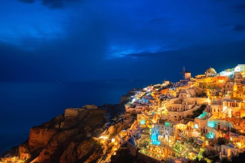 Famous greek iconic picturesque tourist destination Oia village with traditional white houses and