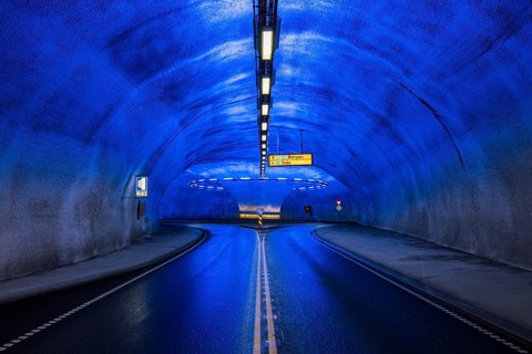 Blue illuminated roundabout in tunnel, Eidfjord, Hardangerfjord, Norway, Europe