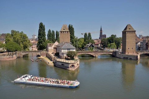 Excursion boat on the River Ill at the Ponts Couverts bridge with towers, UNESCO World Heritage