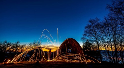 Playing with the steel wool in the hermitage of Agiña at dawn, Navarra