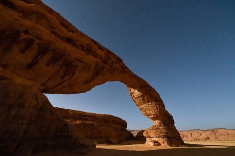 Starry sky above The Arch, also known as Rainbow Rock, near AlUla, Medina Province, Saudi Arabia,
