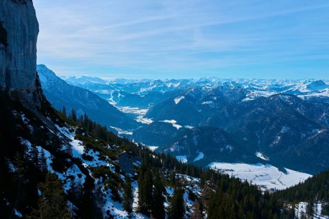 View of rugged mountains with snow and spruces, clear atmosphere, Steinplatte, Waidring, Tyrol,