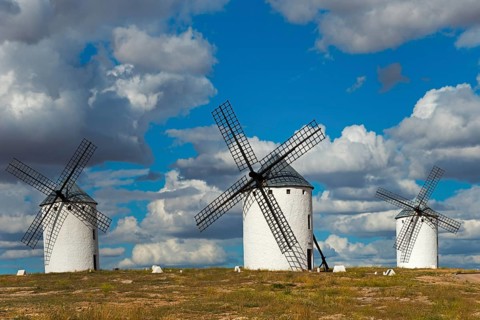 Three windmills in front of a dramatic sky with imposing clouds, Campo de Criptana, Ciudad Real