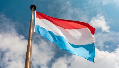 Flags, the national flag of Luxembourg flutters in the wind