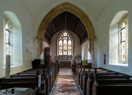 Interior view to altar and east window church of All Saints, Rede, Suffolk, England, UK