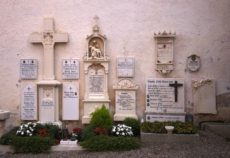 Cemetery, graves, crosses in front of the pilgrimage church Parish Church of Our Lady of Sorrows,