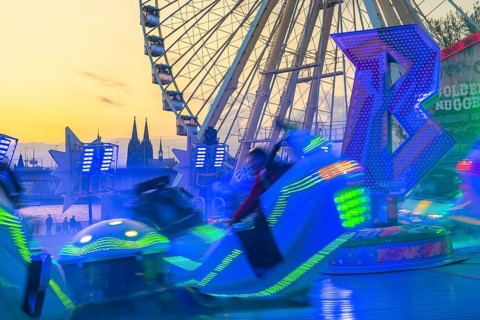 Deutz funfair on the Rhine, at Easter, funfair, break-dancer ride, Ferris wheel, Cologne Cathedral,