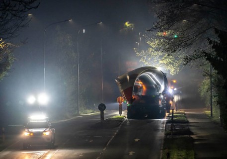 Transport of a 68 metre long, 22 tonne blade of a wind turbine, here in Breckerfeld, with a