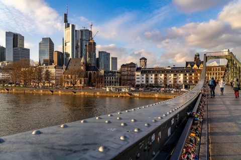 Skyline of the city centre of Frankfurt am Main, river Main, Eiserner Steg bridge, dusk, Hesse,