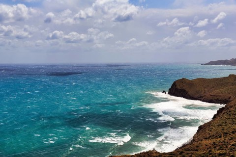 Mirador de La Amatista with views of the rocky coast and turquoise sea, coastline at La Isleta,
