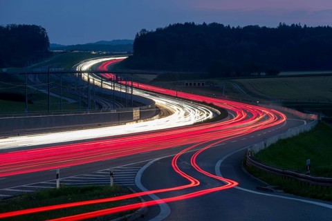 Tracers on the A8 motorway, winding road, evening, long exposure, Swabian Alb, Baden-Württemberg,