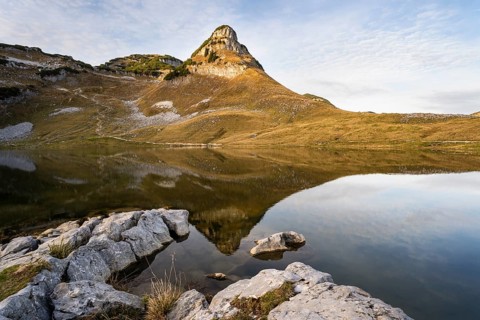 Lake Augstsee and the Atterkogel mountain on the Loser. Autumn, good weather, blue sky, little