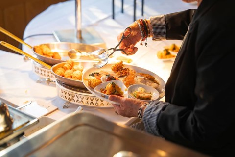 One person fills their plate with a selection of delicious buffet dishes, Europäischer Hof,