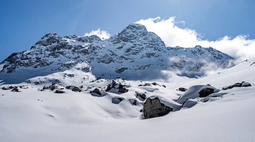 Picturesque snow-covered mountain landscape with Piz Kesch summit, Bündner Haute Route ski tour,