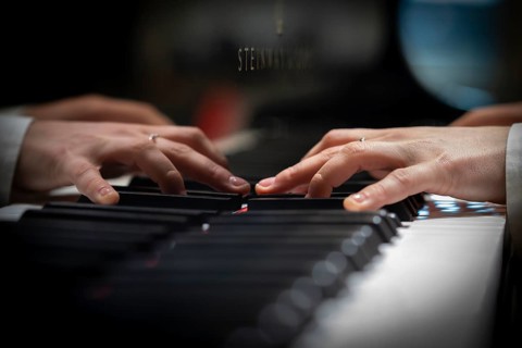 Hands of a young pianist playing on the keyboard of a Steinway & Sons grand piano, Stuttgart,