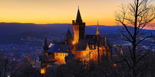 Atmospheric view of the illuminated Wernigerode Castle at sunset, Harz Mountains, Saxony-Anhalt,