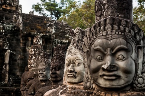 Figures on the bridge to Angkor Thom, sunset, Angkor Wat, Angkor, UNESCO World Heritage Site, Siem