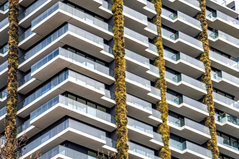 Facade of the Eden Tower on Europa-Allee in Frankfurt am Main, green facade, residential building,