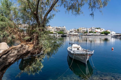 The village of Agios Nikolaos, in the eastern part of Crete, view over Lake Voulismeni, connected