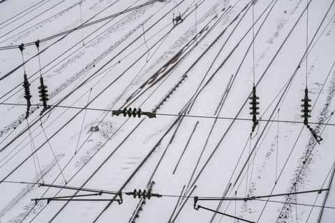 Onset of winter with lots of fresh snow and temperatures below -5 degrees during the day, railway