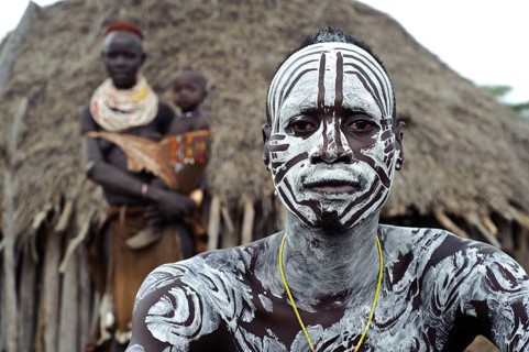 Portrait of a husband and wife and child from the Karo tribe, Omo valley, Ethiopia, Africa