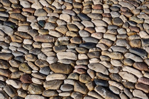 Detailed view of an area paved with different coloured pebbles, Knights Street, Rhodes Old Town,