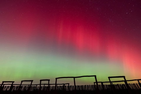 Northern lights (aurora borealis) over the ring sanctuary of Pömmelte, prehistoric circular ditch