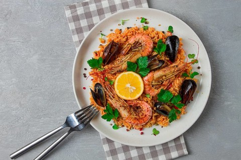 Seafood paella, shrimp and mussels risotto, rice, homemade, top view, no people