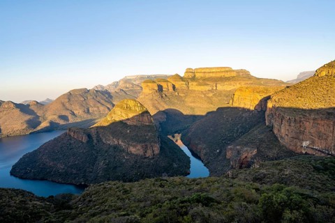 Sunset at Blyde River Canyon with GIpfel Three Rondawels, view of canyon with Blyde River and Mesa