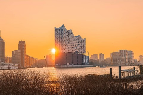 Sunrise behind the Elbphilharmonie reflected on the water, Hamburg, Germany, Europe