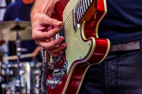 Guitarist on stage playing his instrument during a show, Belo Horizonte, Minas Gerais, Brazil,