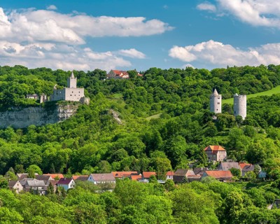 View of Rudelsburg castle ruins, Saaleck castle and Kreipitzsch manor, in the Saale valley, near