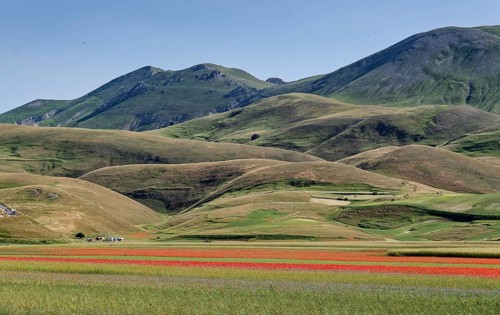 Mountain landscape on the edge of the Pian Grande di Castelluccio di Norcia plateau in the Monti