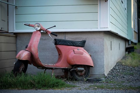 Pink-coloured Vespa in front of a house wall, Naantali or Nådendal, Baltic Sea coast, Finland,