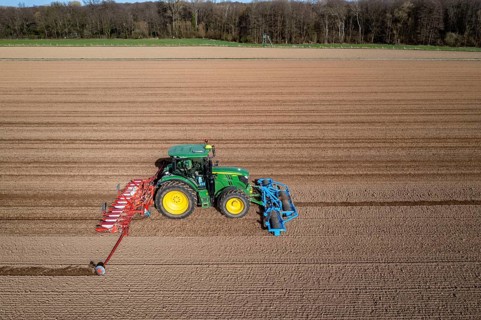 Sugar beet being sown in spring, precision sowing with precision seed drill, behind a tractor,