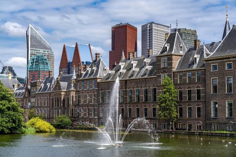 The historic Binnenhof, seat of the Dutch government, Hofvijver pond, skyline of the city centre at