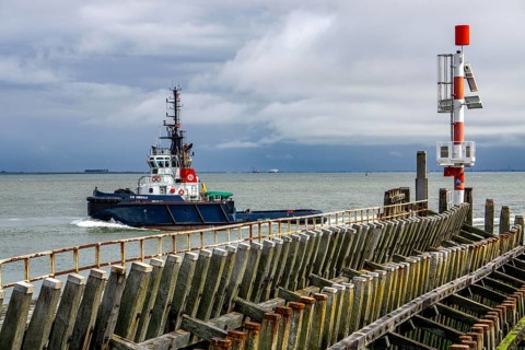 Harbour tug VB Emerald in the Western Scheldt, entering the harbour of Vlissingen, Zeeland,