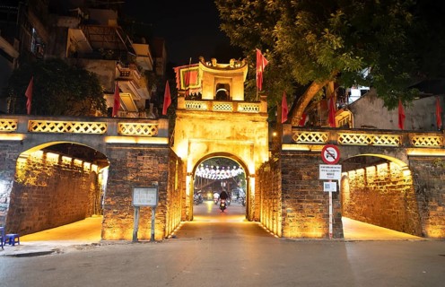 Illuminated old town gate at night, Hanoi, Vietnam, Asia